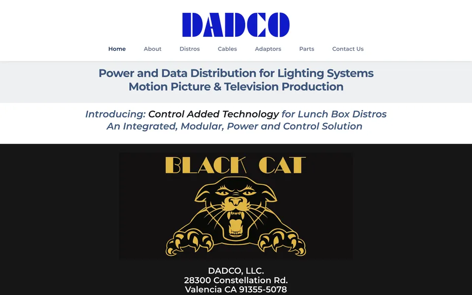 DADCO home page before: blue logo, text headings and a black cat graphic on white